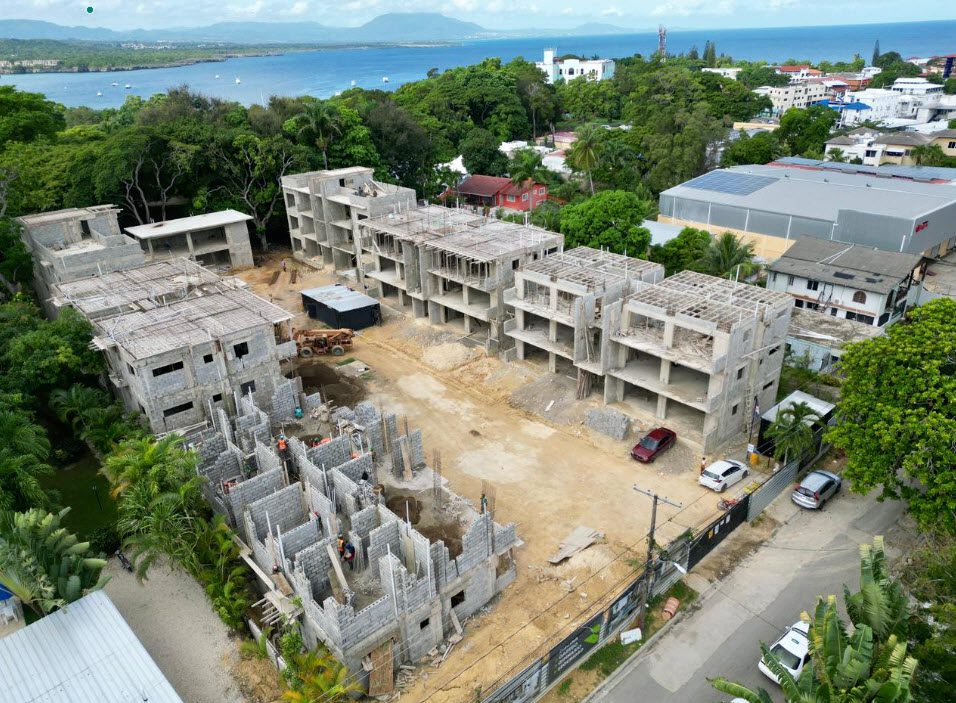 buyDRproperty Drone view of a large construction site near a coastal area Sosua Real Estate