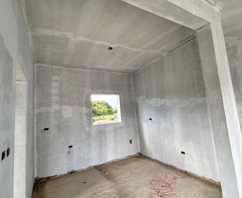 buyDRproperty Unfinished room with concrete walls and floor, small window showing greenery outside Sosua Real Estate