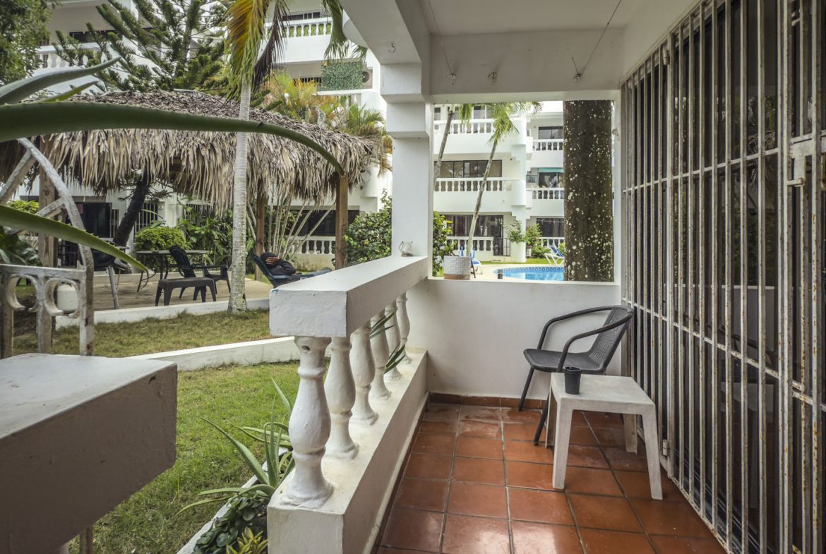 buyDRproperty Sosúa condo balcony view with pool and playa access. Sosua Real Estate