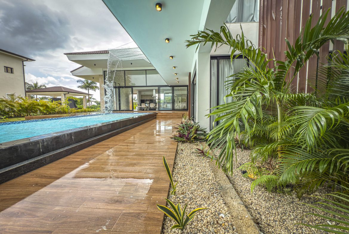 buyDRproperty Luxury villa with pool and waterfall feature at Sosua Ocean Village. Sosua Real Estate