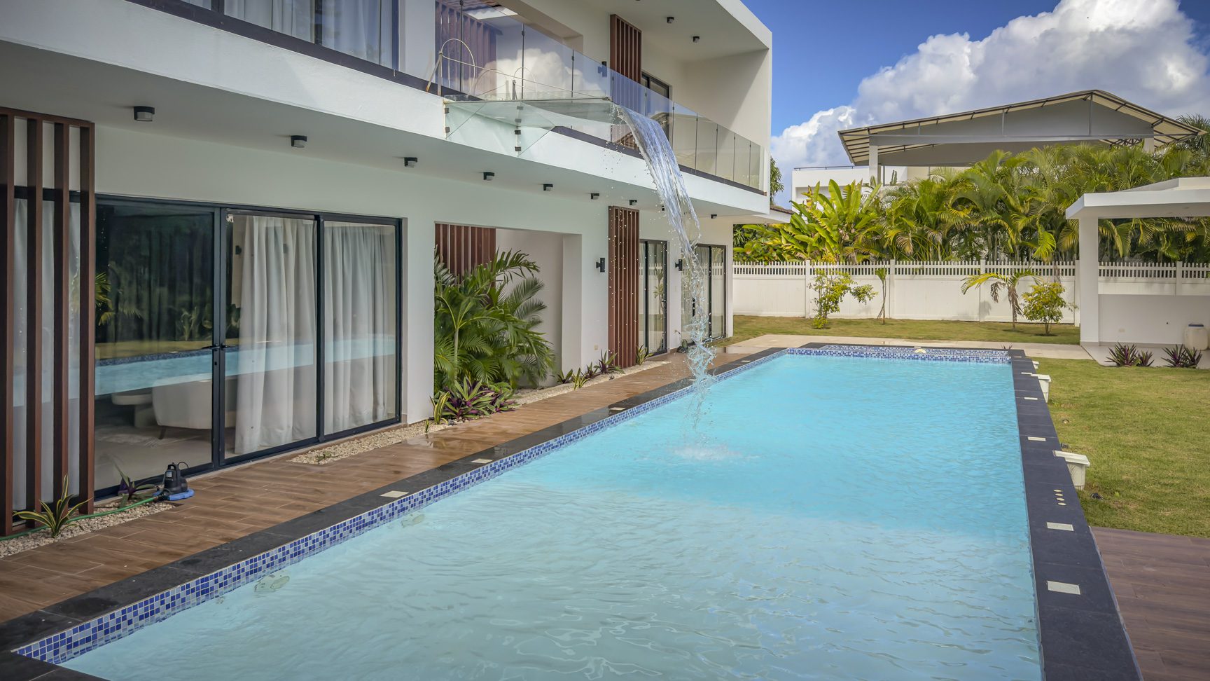 buyDRproperty Luxury villa with pool and waterfall feature in Sosua Ocean Village. Sosua Real Estate