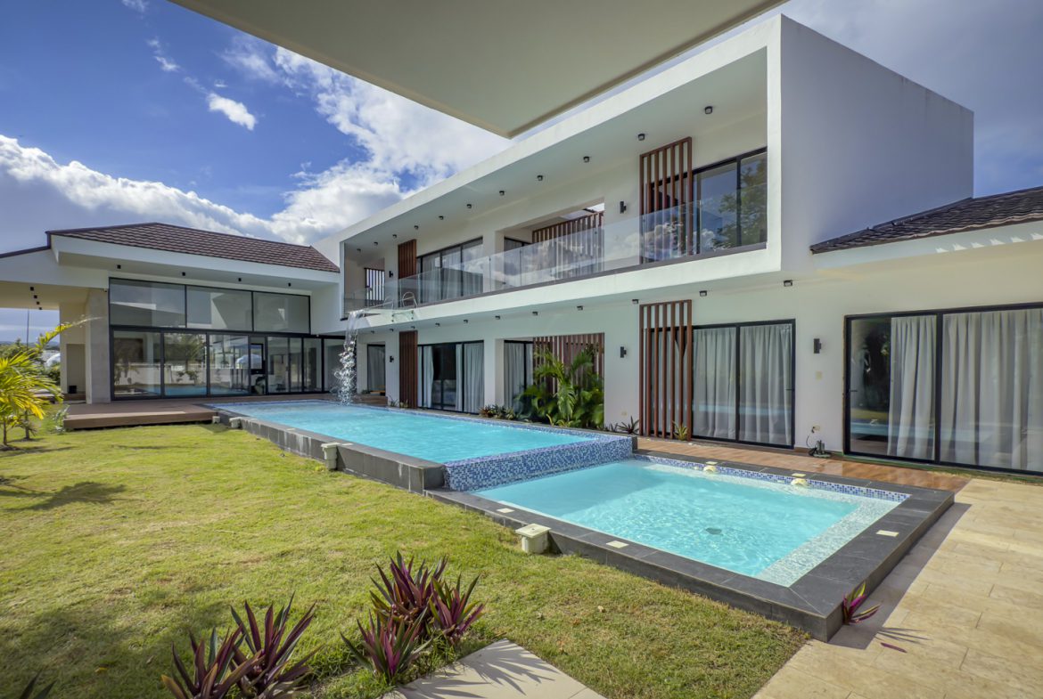 buyDRproperty Luxury villa with pool in Sosua Ocean Village. Modern, two-story architecture. Sosua Real Estate