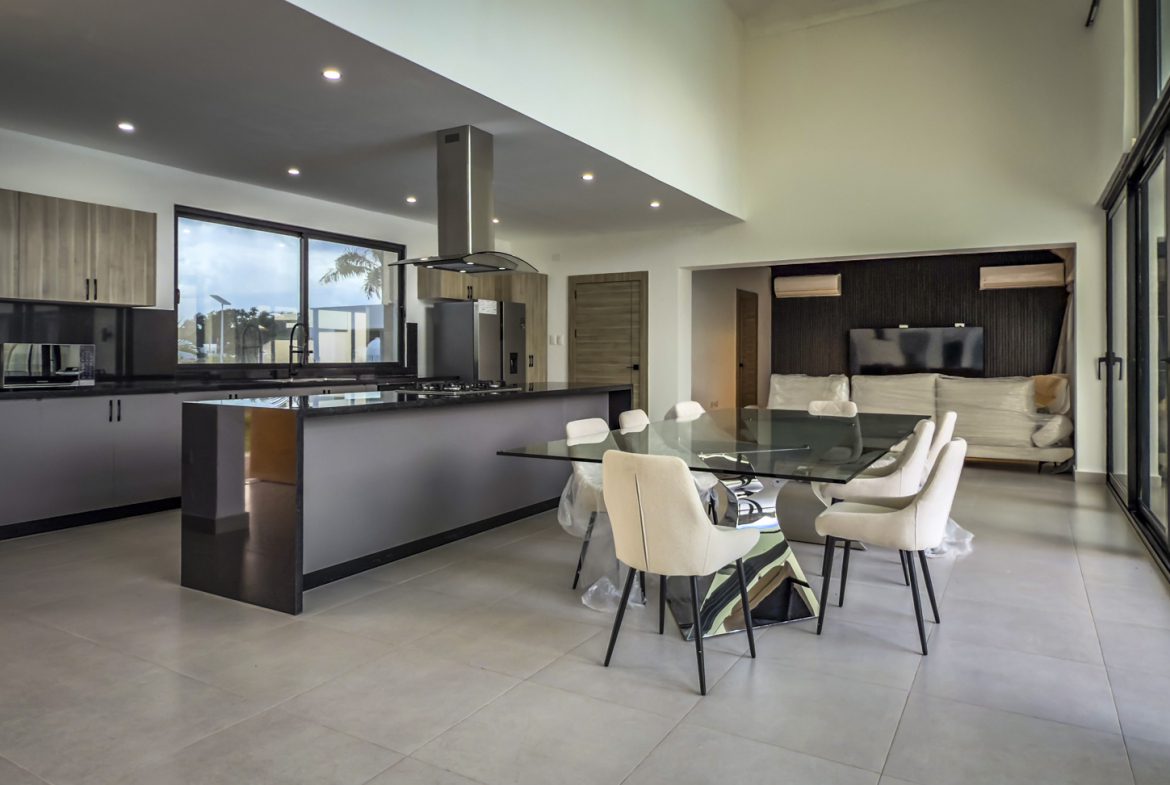 buyDRproperty Modern kitchen and dining area in a luxury villa. Sosua Real Estate