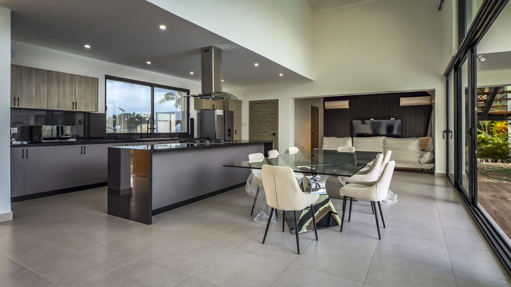 buyDRproperty Modern kitchen and dining area in a luxury villa. Sosua Real Estate