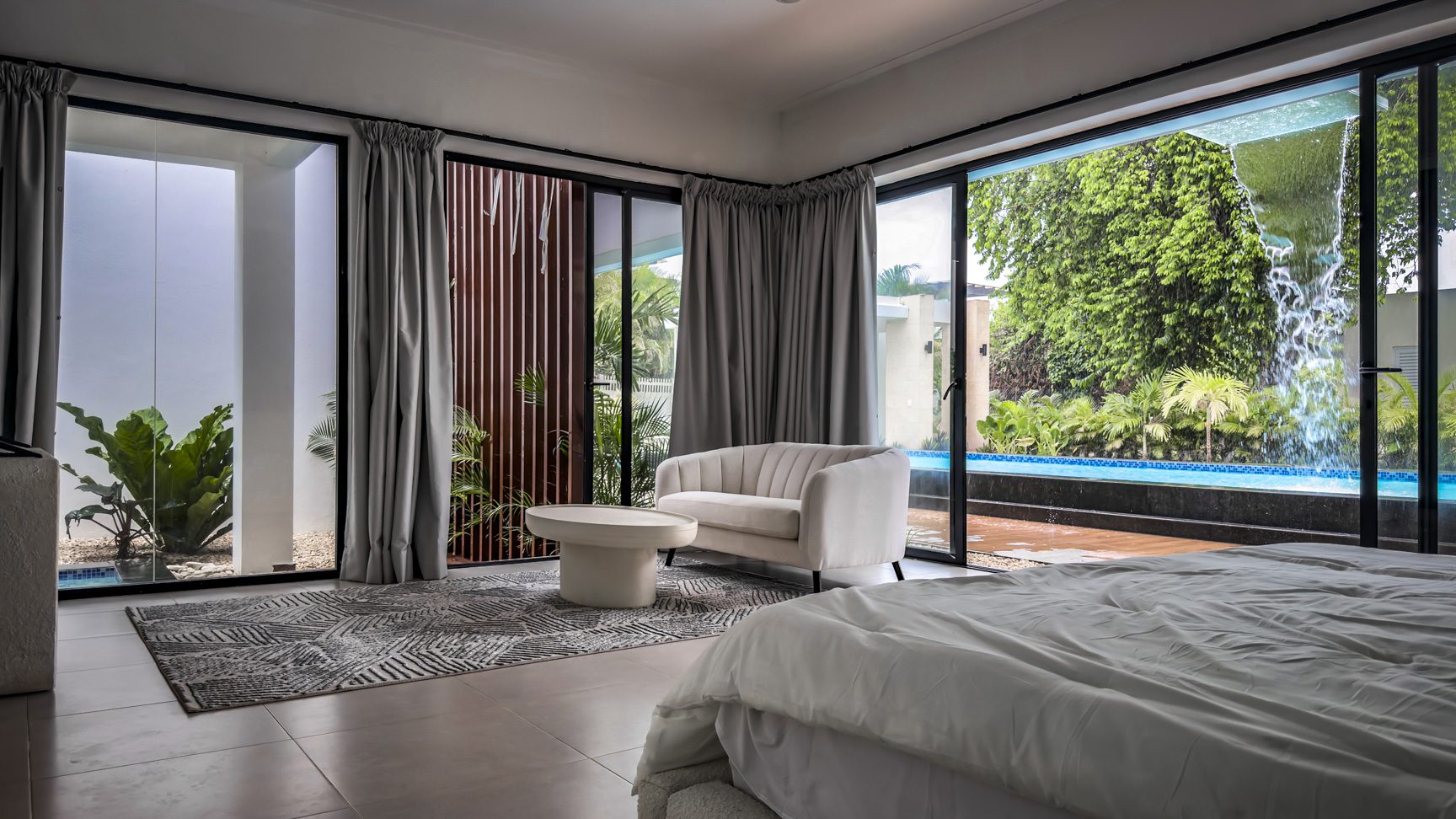 buyDRproperty Luxury villa bedroom with pool view in Sosua Ocean Village Sosua Real Estate