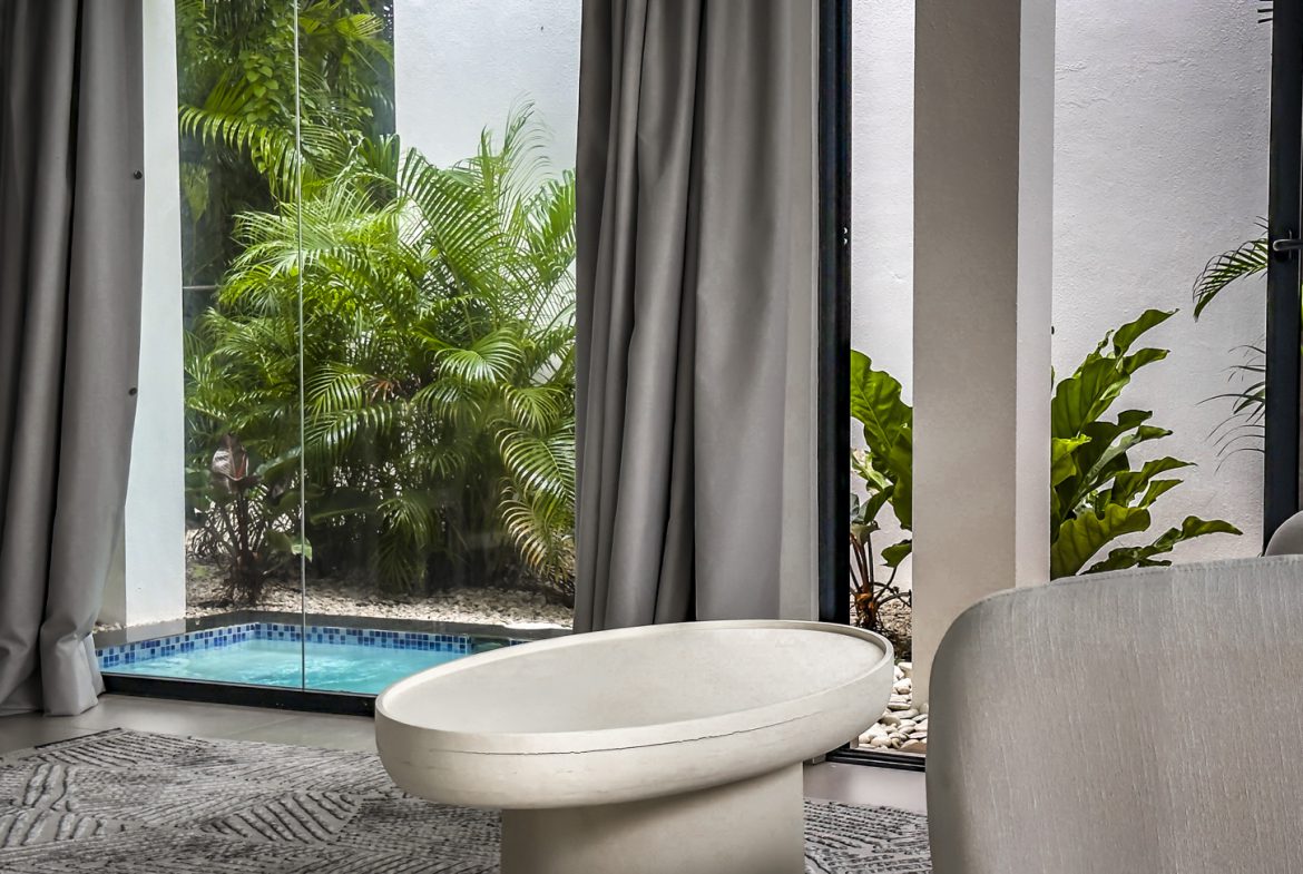 buyDRproperty Luxury villa interior with pool view in Sosua Ocean Village. Sosua Real Estate