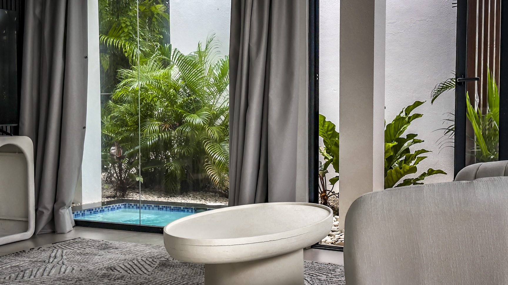 buyDRproperty Luxury villa interior with pool view in Sosua Ocean Village. Sosua Real Estate