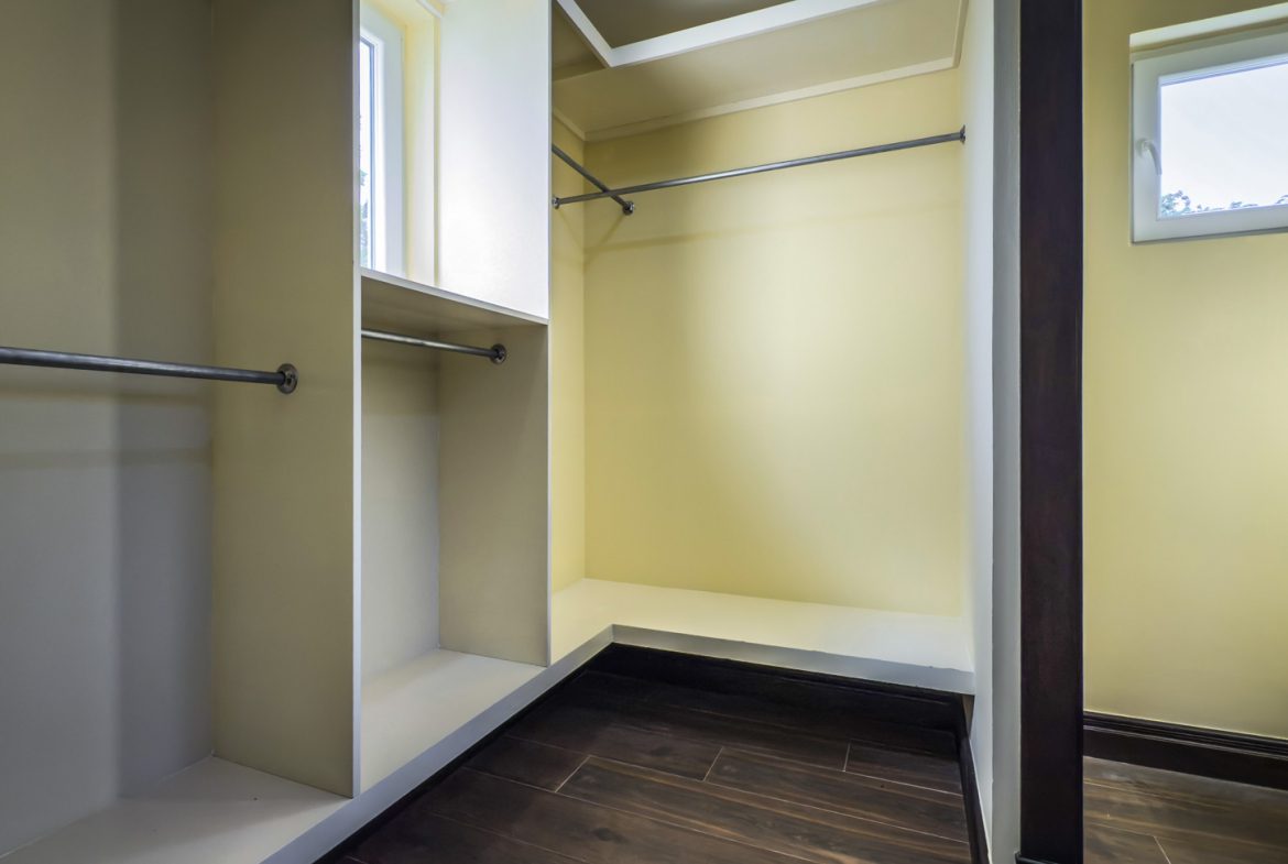 buyDRproperty Walk-in closet with hanging rods and shelves, part of a 3-bedroom villa for sale. Sosua Real Estate