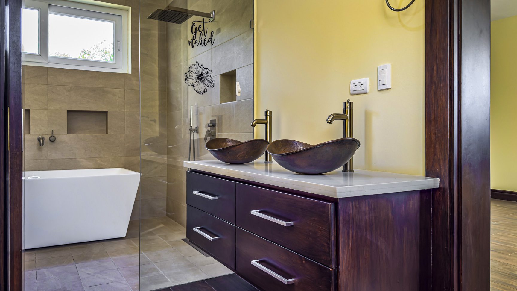 buyDRproperty Bathroom with double sink, walk-in shower, and modern bathtub in La Mulata villa. Sosua Real Estate