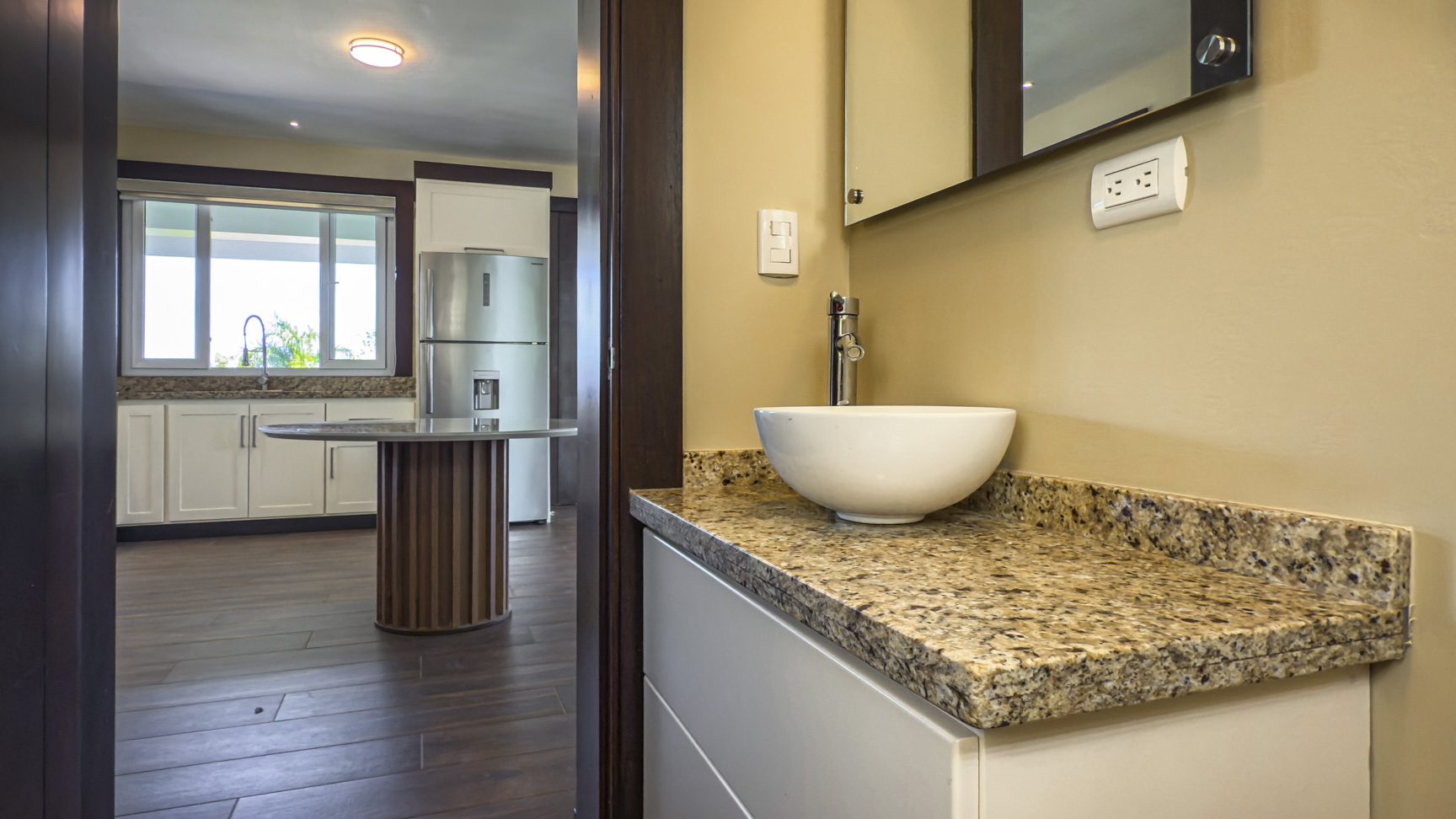 buyDRproperty Modern bathroom with granite countertop and vessel sink, part of a 3 bedroom villa for sale in La Mulata. Sosua Real Estate