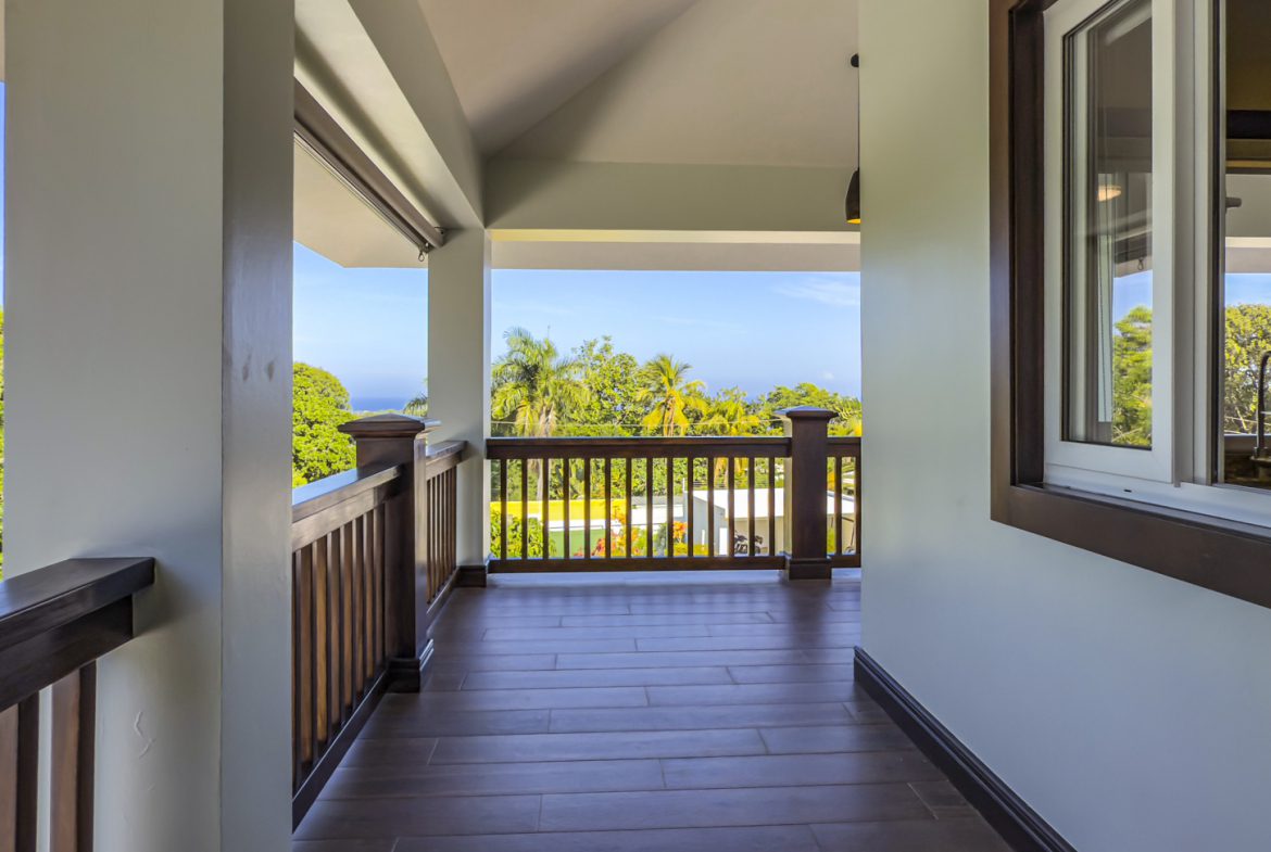 buyDRproperty Balcony view of the 3-bedroom villa for sale in La Mulata, showcasing the outdoor space and tropical scenery. Sosua Real Estate