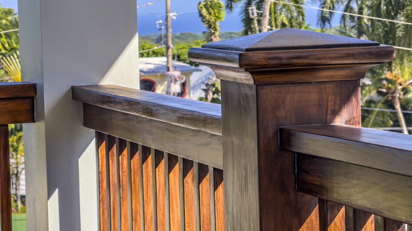 buyDRproperty Detail of wooden railing in La Mulata villa, showcasing design and outdoor view. For Sale! Sosua Real Estate