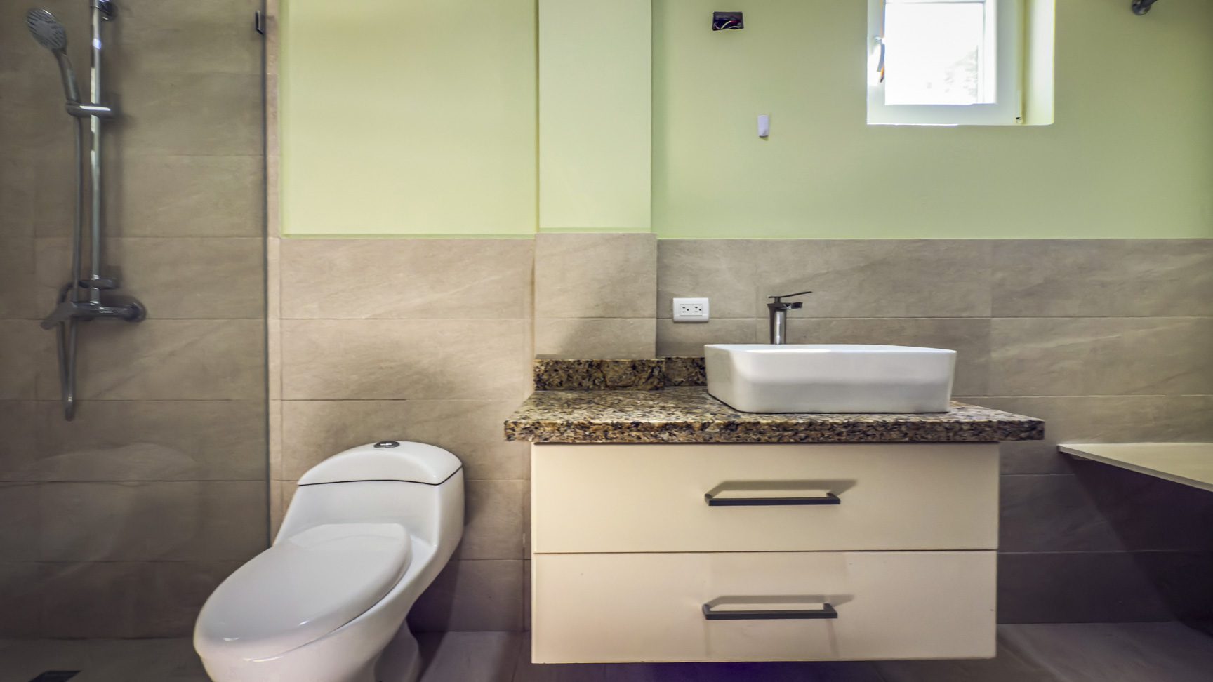 buyDRproperty Bathroom with toilet, vanity, and shower in La Mulata villa. Sosua Real Estate