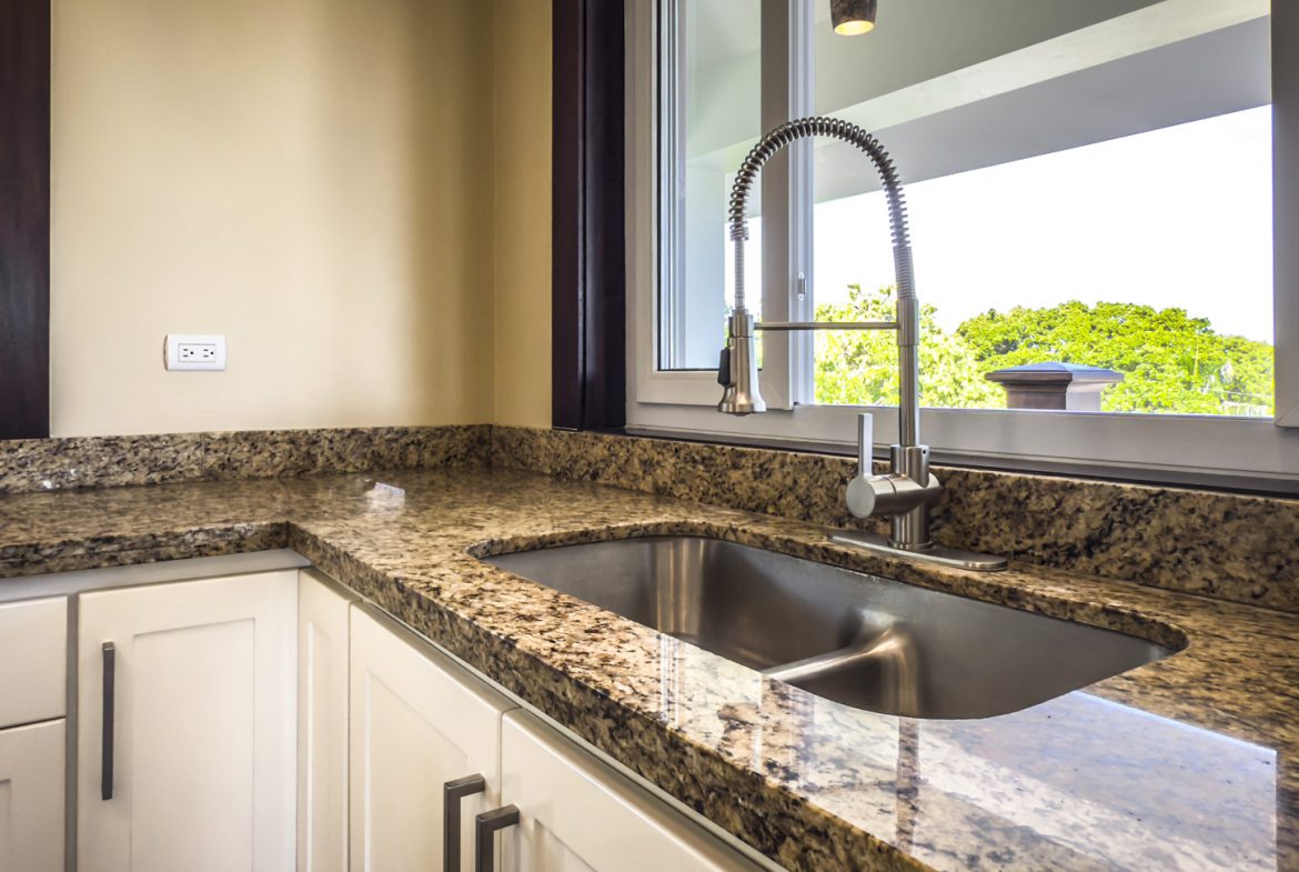 buyDRproperty Kitchen sink with granite countertops in a La Mulata 3-bedroom villa for sale. Sosua Real Estate