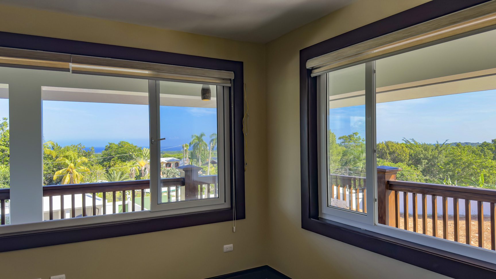 buyDRproperty Bright room with two windows showcasing the view from this 3 bedroom villa for sale in La Mulata. Sosua Real Estate
