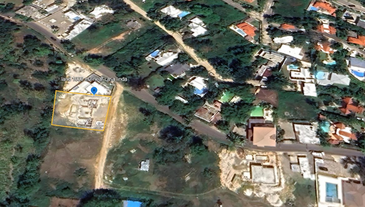 buyDRproperty Aerial view of land for sale near Casa Linda, with construction underway. Sosua Real Estate