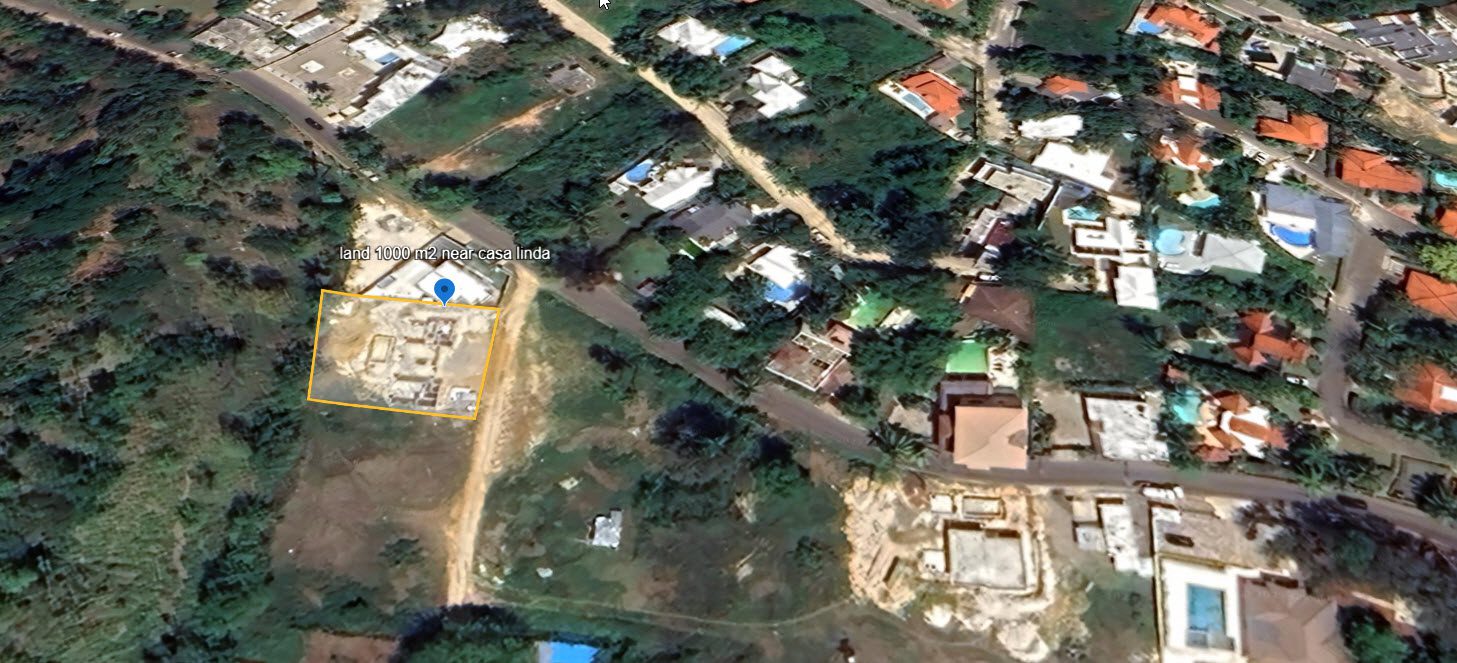 buyDRproperty Aerial view of land for sale near Casa Linda, with construction underway. Sosua Real Estate