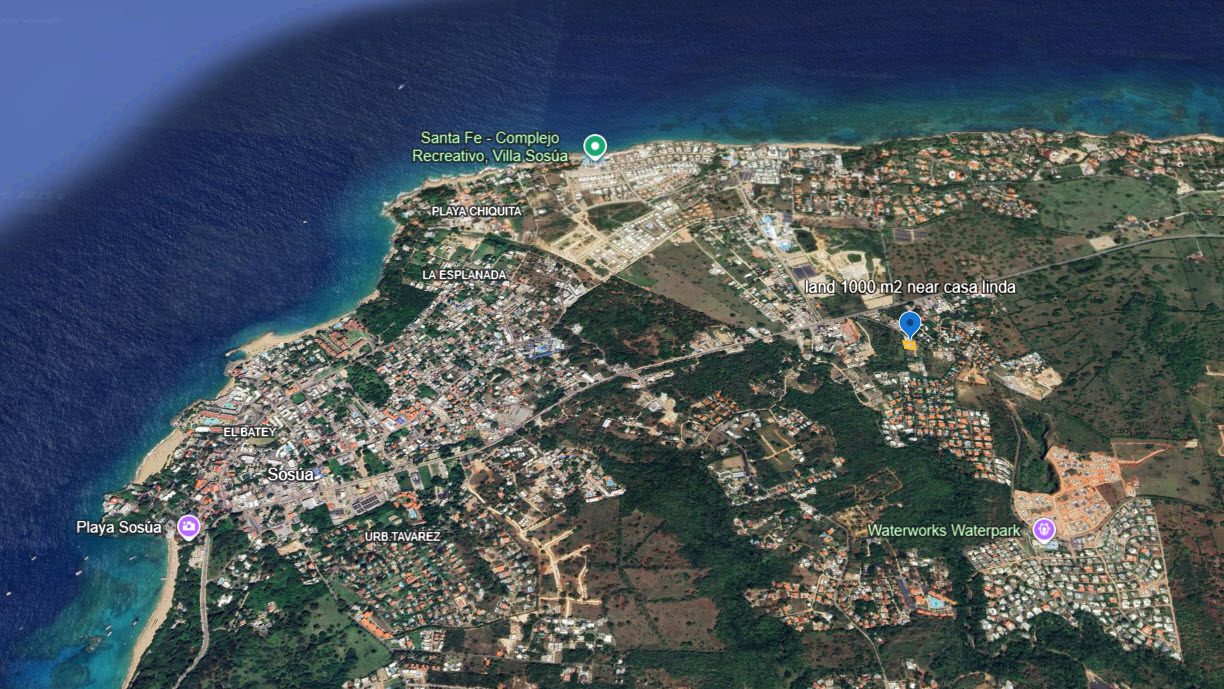 buyDRproperty Aerial view of Sosúa, Dominican Republic, showing beaches, residential areas, and the Waterworks Waterpark. Sosua Real Estate