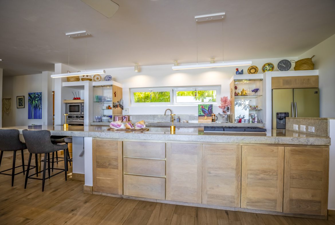 buyDRproperty Modern kitchen with stainless steel appliances and a granite countertop Sosua Real Estate