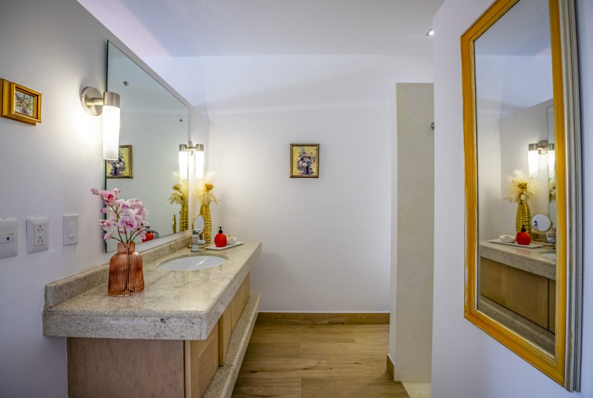 buyDRproperty Bathroom with granite countertop, modern lighting, and decorative accents. Sosua Real Estate