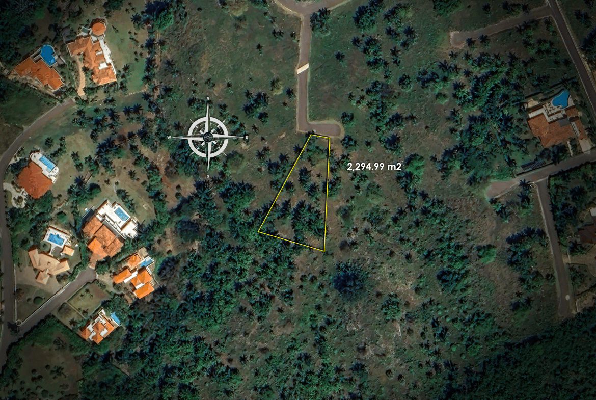 buyDRproperty Aerial view of a plot of land measuring 2,274.99 square meters with surrounding houses Sosua Real Estate