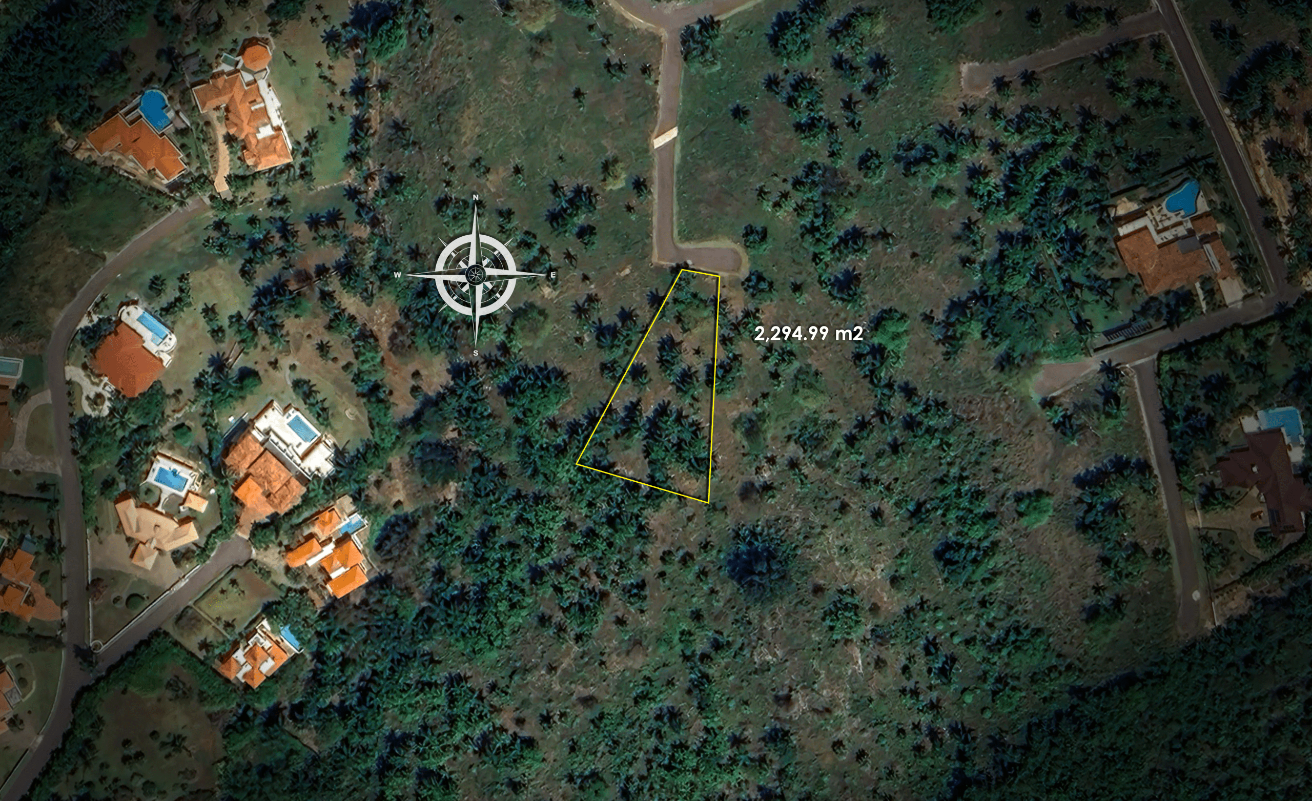 buyDRproperty Aerial view of a plot of land measuring 2,274.99 square meters with surrounding houses Sosua Real Estate