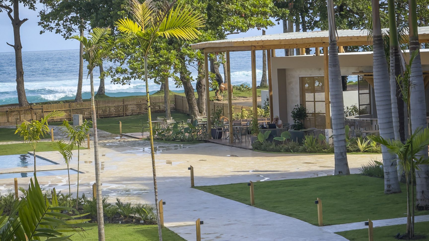 buyDRproperty Beachfront resort with pool, restaurant, and ocean views. Relaxing tropical vacation destination. Sosua Real Estate