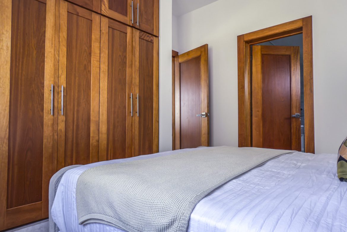 Bedroom with modern design bed, and storage. Closet design for bedroom storage.