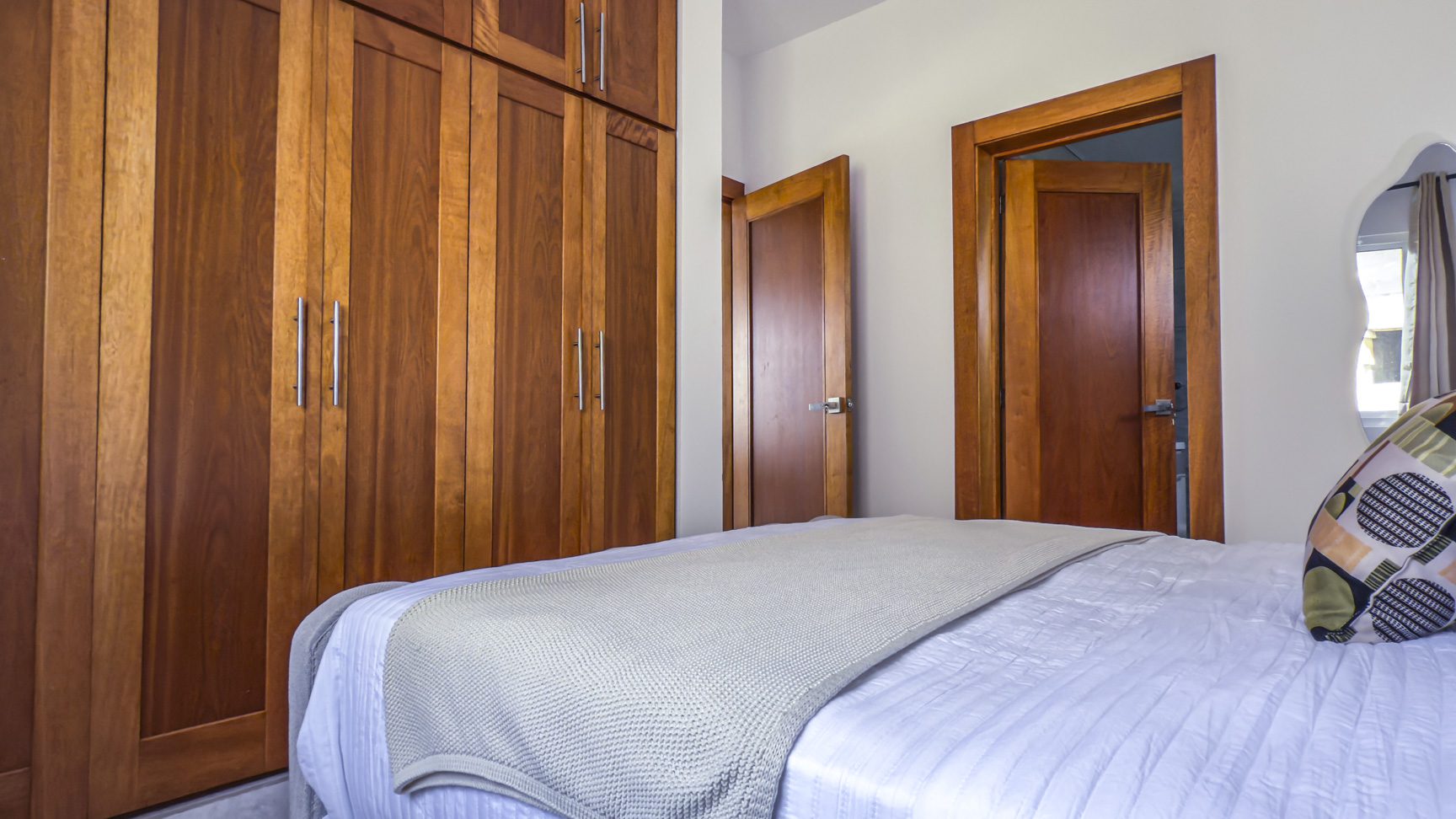 Bedroom with modern design bed, and storage. Closet design for bedroom storage.