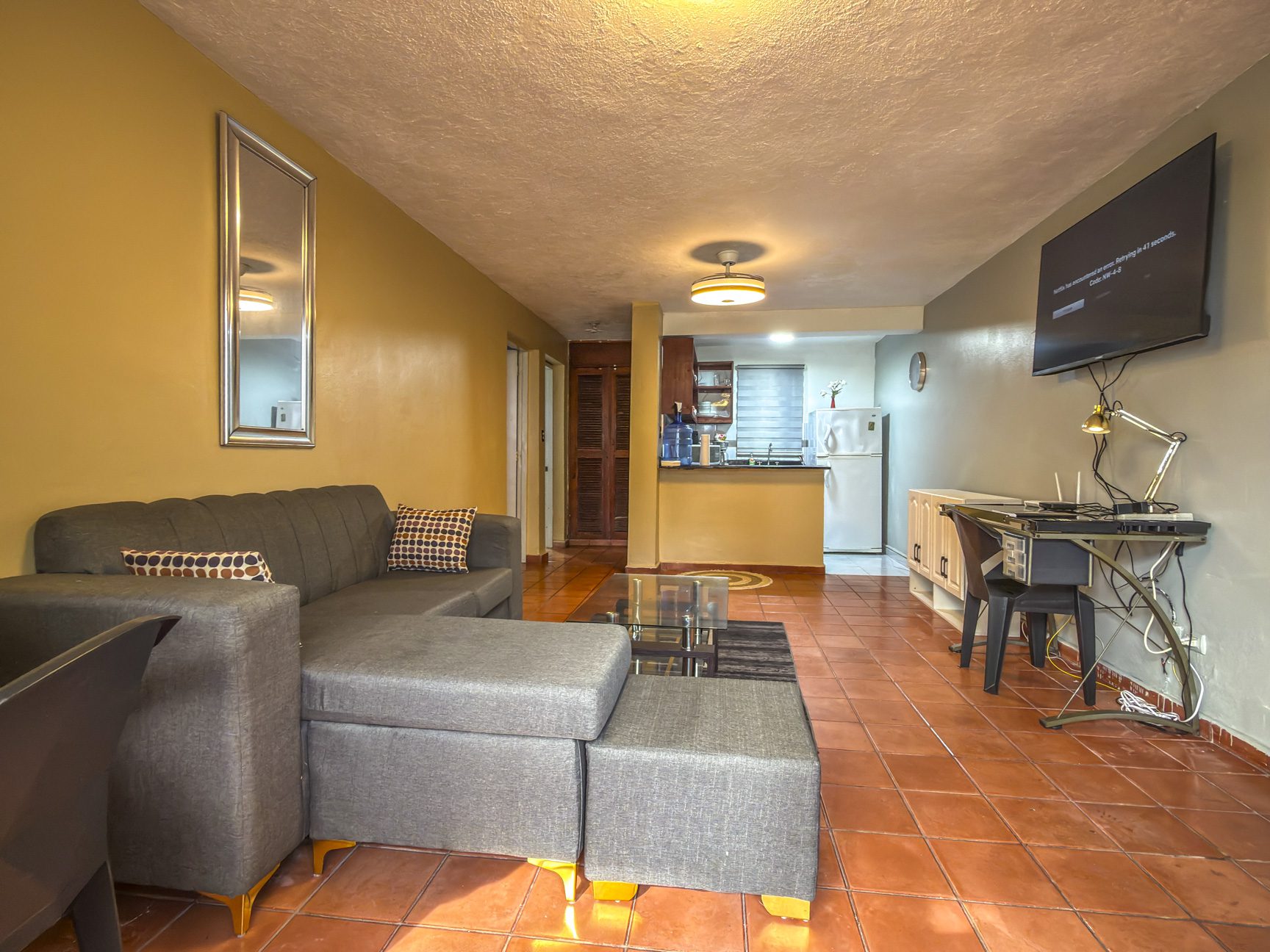 Living room and dining area of 1-bedroom condo for sale in central Sosúa