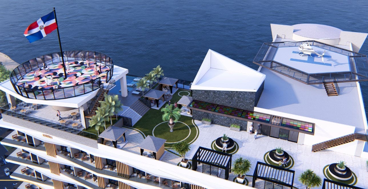 buyDRproperty Luxury resort rooftop with helipad, pool, and Dominican Republic flag. Sosua Real Estate