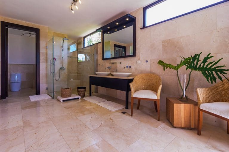 buyDRproperty Spacious, modern bathroom with marble floors, a glass shower, and double vanity Sosua Real Estate