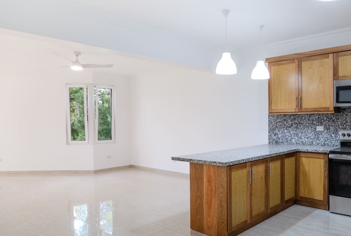Modern kitchen and living area in HISPAIOLA BEACH condo, Puerto Plata