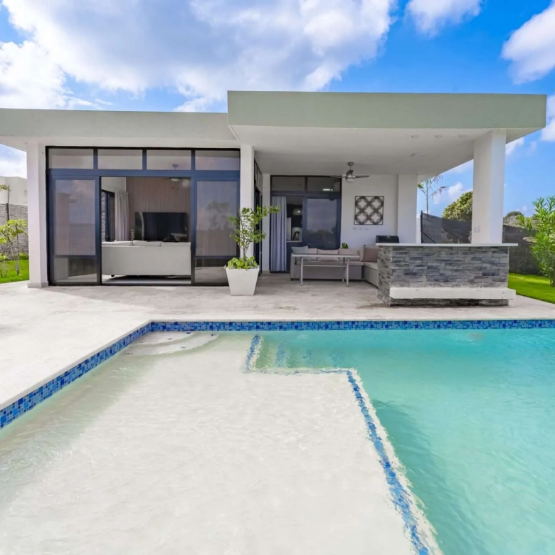 buyDRproperty Modern villa with swimming pool and outdoor seating area Sosua Real Estate
