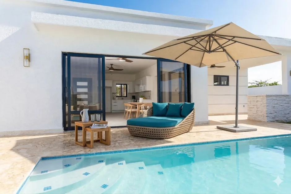 buyDRproperty Luxury villa with pool, chaise lounge, and outdoor seating Sosua Real Estate