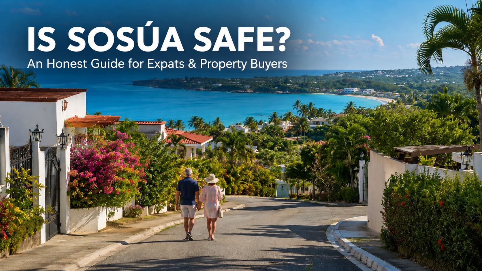 Couple walking down a road in Sosúa, Dominican Republic, with the bay in the background.