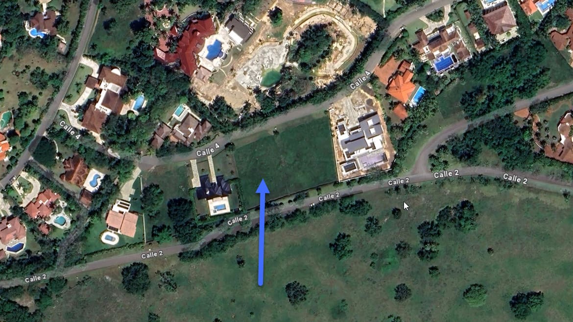 Aerial view of luxury homes and green spaces with street names visible.