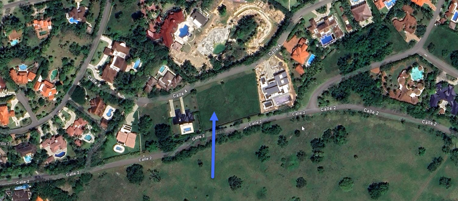 Aerial view of luxury homes and green spaces with street names visible.