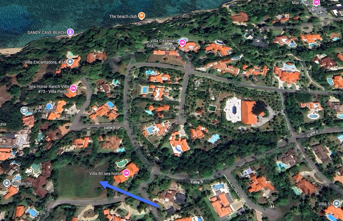 Aerial view of luxury villas and beaches in a tropical coastal community
