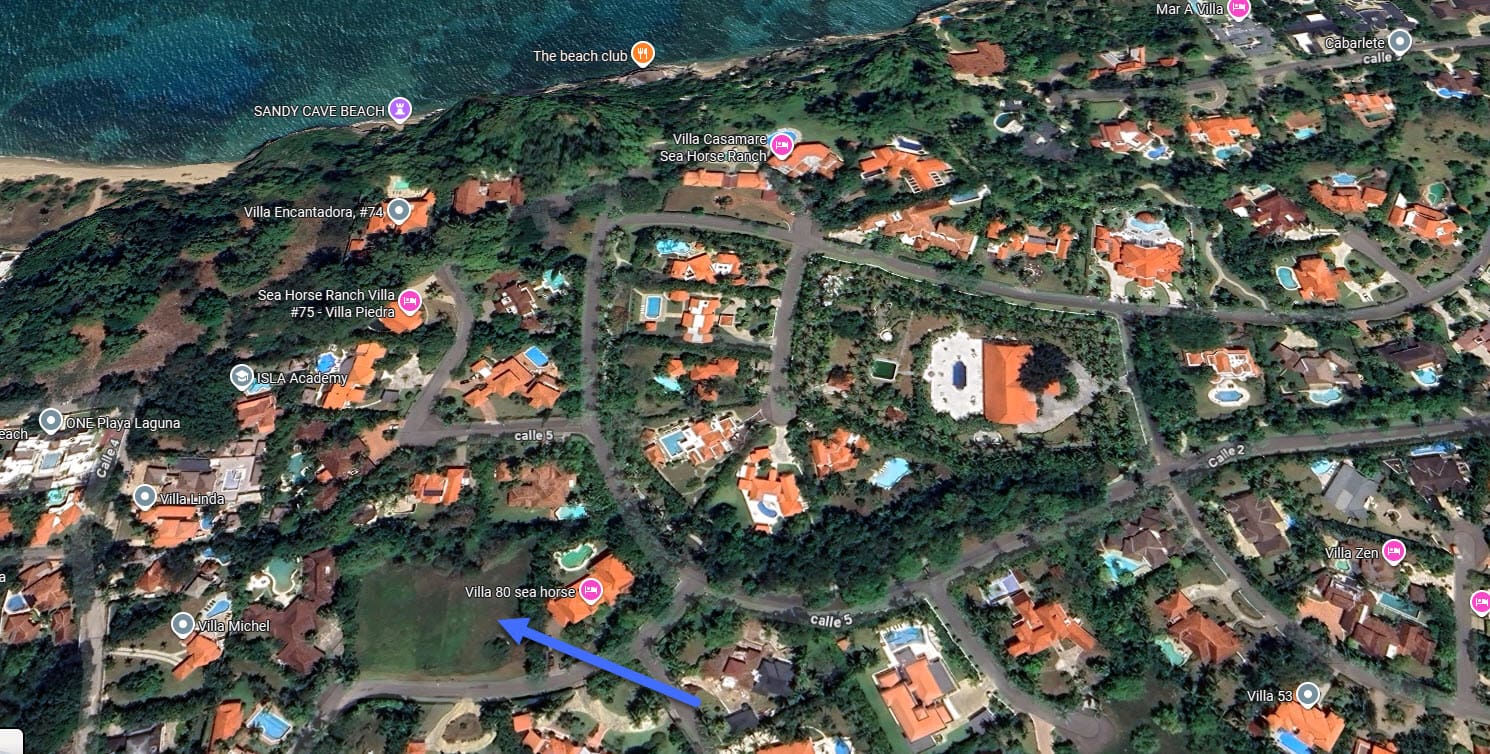 Aerial view of luxury villas and beaches in a tropical coastal community