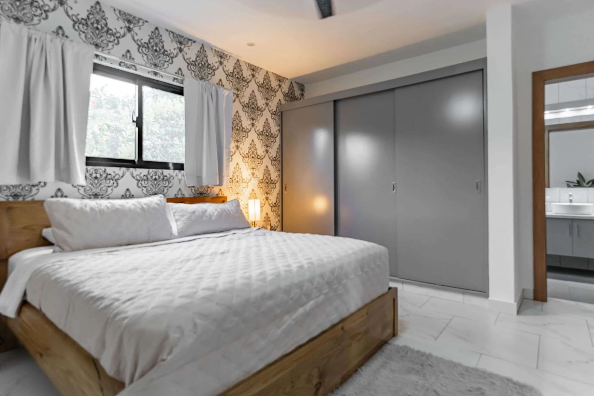 3BR Villa Sunseeker Casa Linda master bedroom with king bed and sliding wardrobes