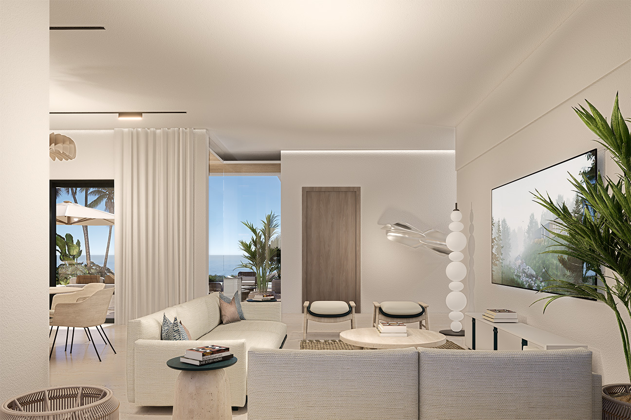Bright, modern living room with ocean view, white sofa, and minimalist decor