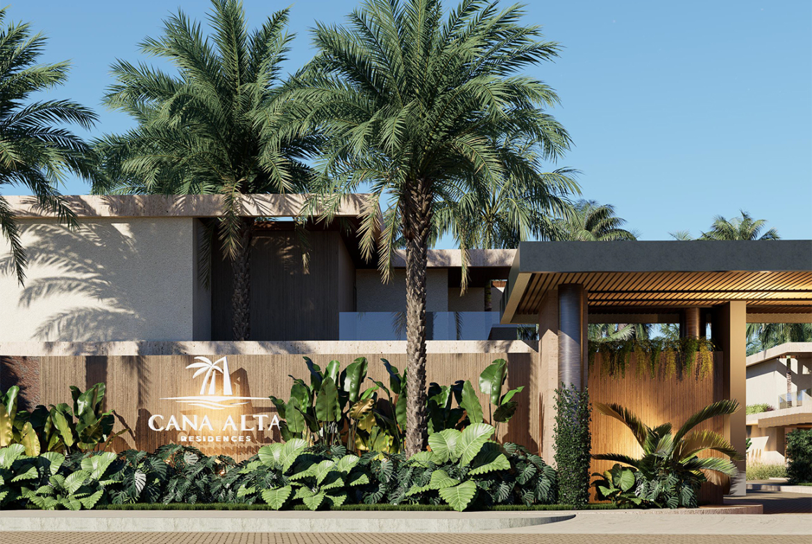 Cana Alta Residences entrance with palm trees and lush landscaping.