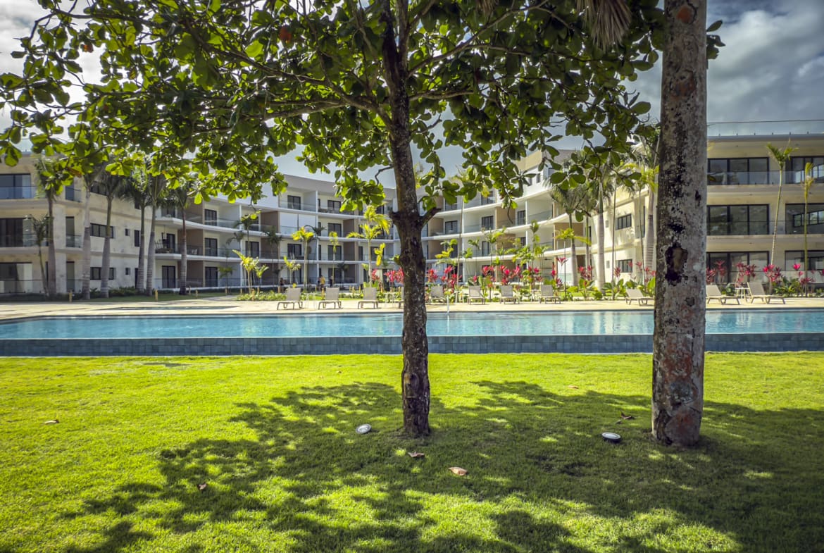 Modern resort with swimming pool and palm trees