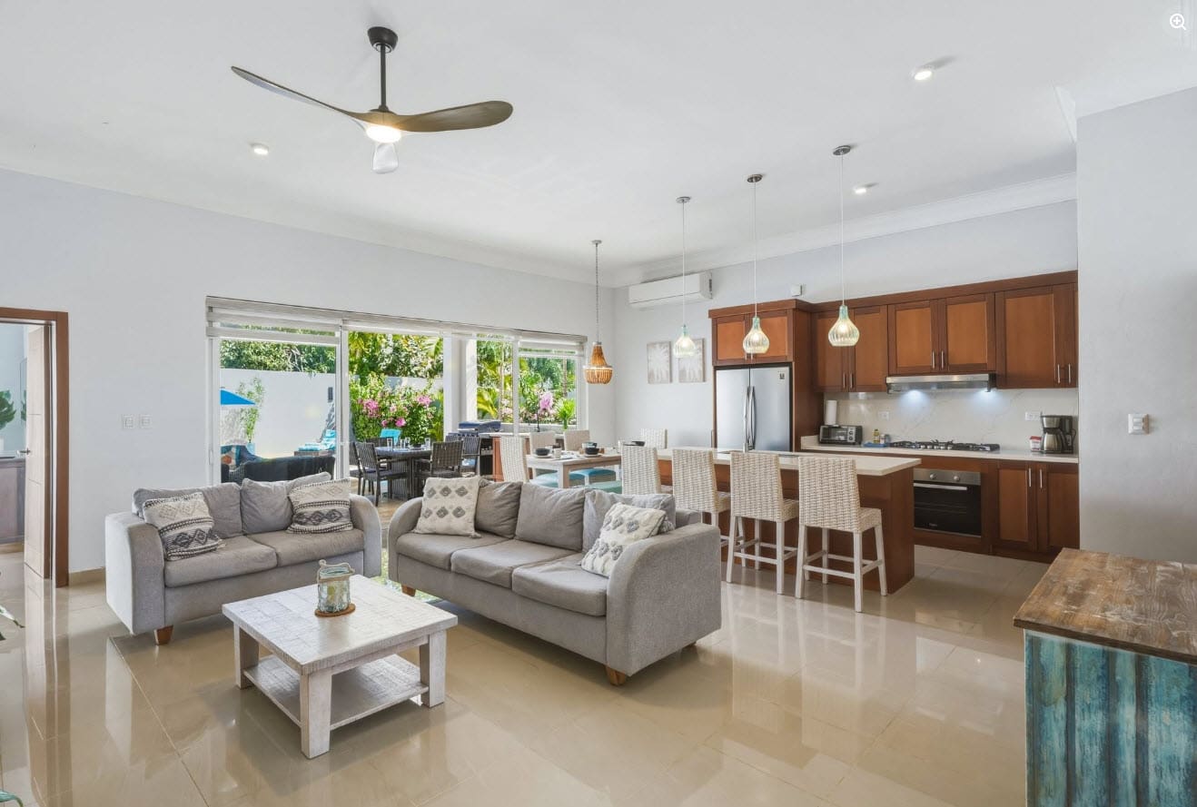 Open-plan living and dining area with modern kitchen and comfortable seating