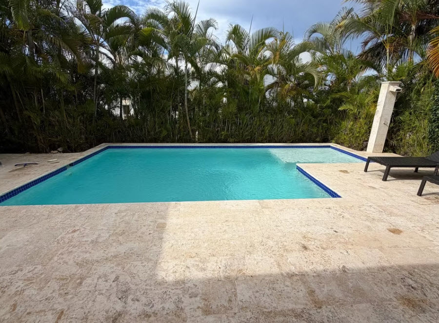 Luxury villa with private pool surrounded by palm trees, Caribbean escape