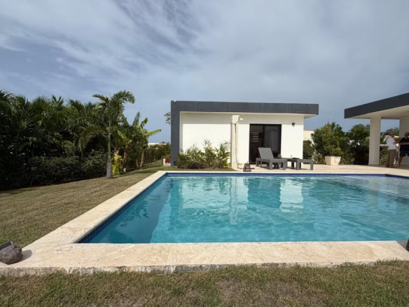 Modern villa with pool and lush tropical landscaping