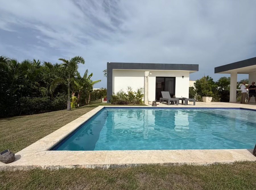 Modern villa with pool and lush tropical landscaping