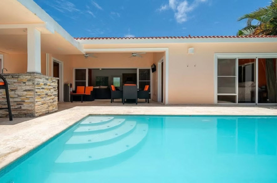 Modern villa with swimming pool and outdoor seating area