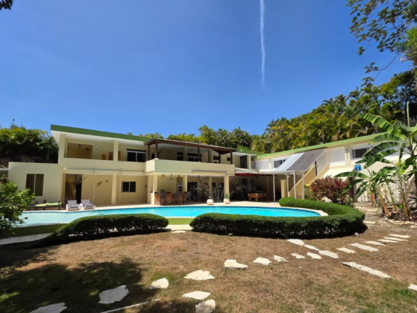 Luxury villa with pool and lush tropical landscaping